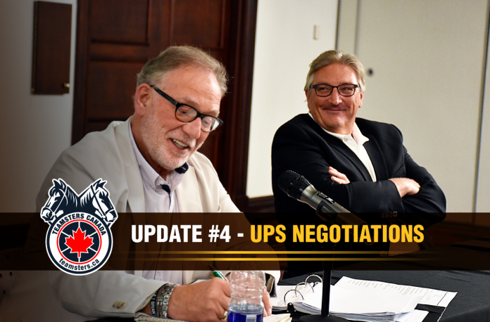 From left to right: Richard Eichel, director of the Teamsters Canada Parcel Division, and François Laporte, president of Teamsters Canada, during UPS negotiations in Quebec City.